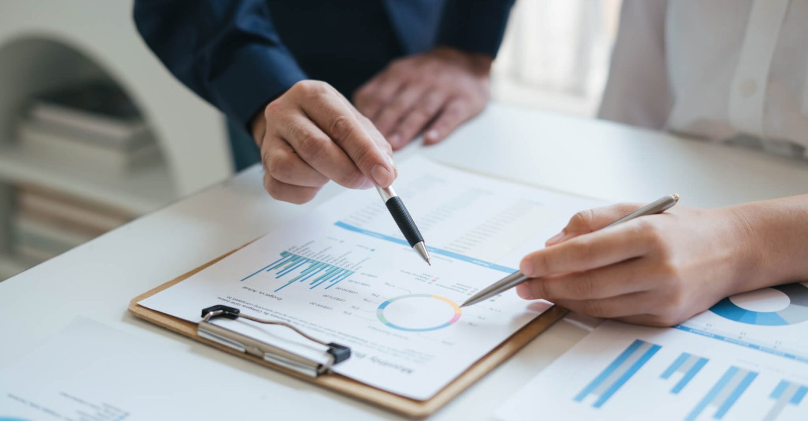 business-sales-consultant-discussing-in-data-documents-at-modern-office-.jpg